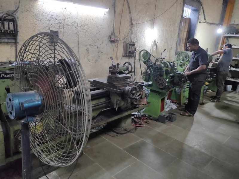 Toolroom lathes with operators at work.